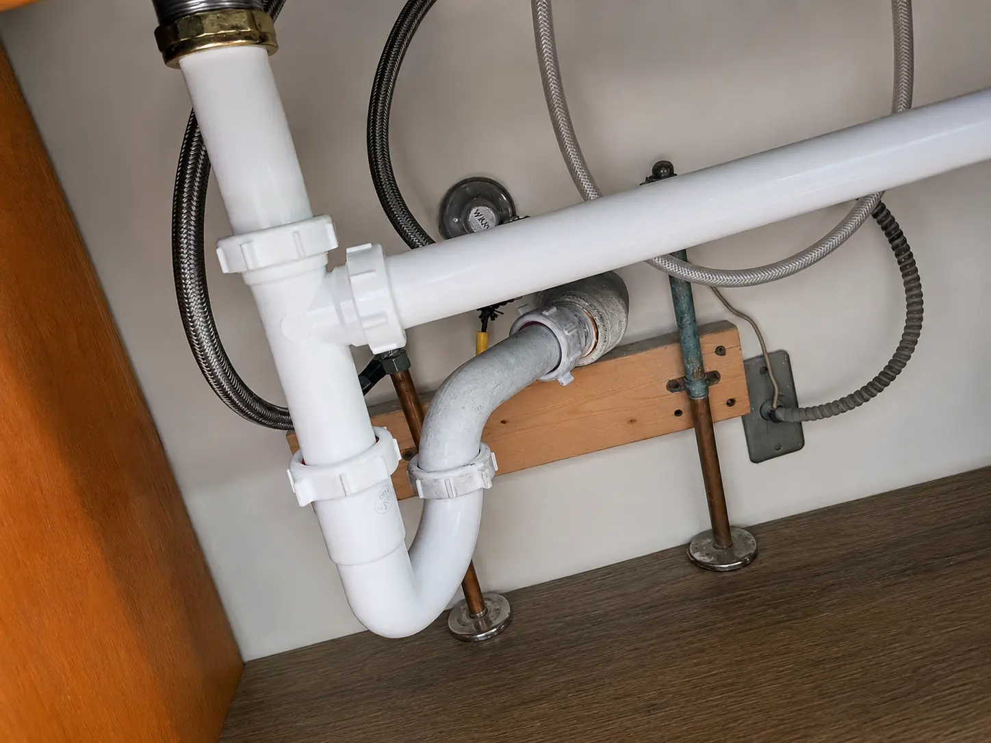 White under-sink drain and trap connections