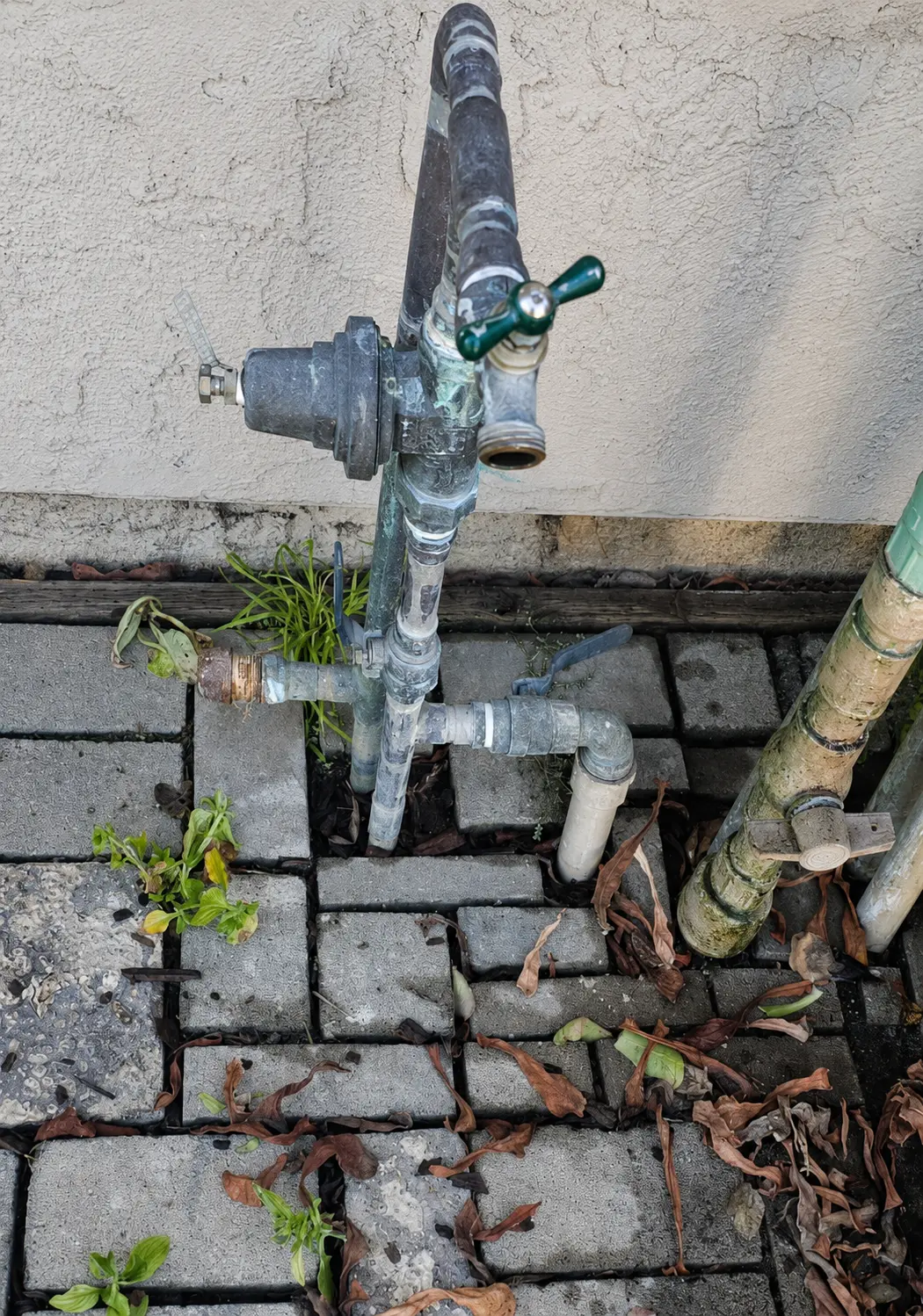 Weathered exterior main water valve before repair