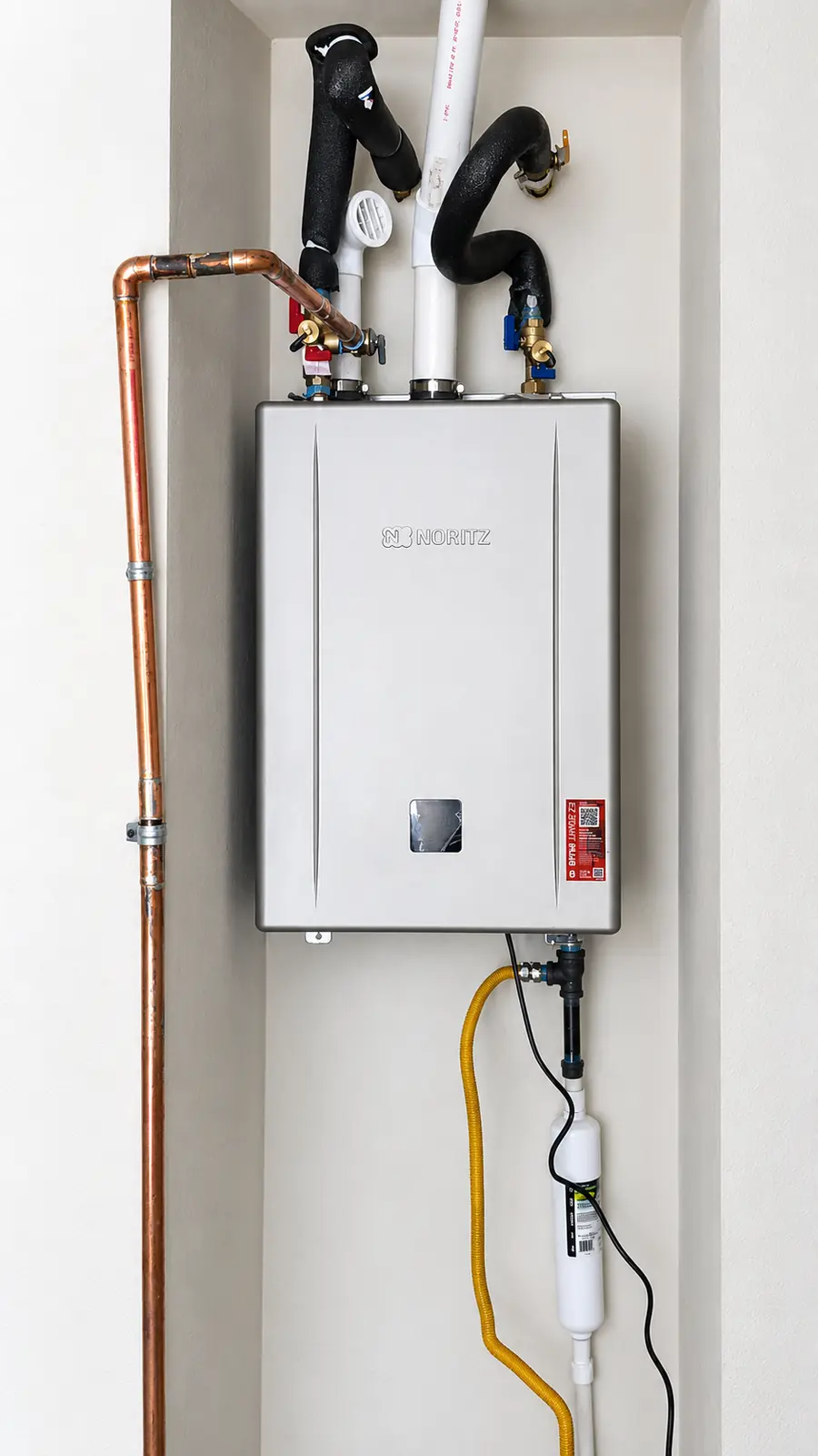 Noritz tankless water heater in a recessed exterior cabinet