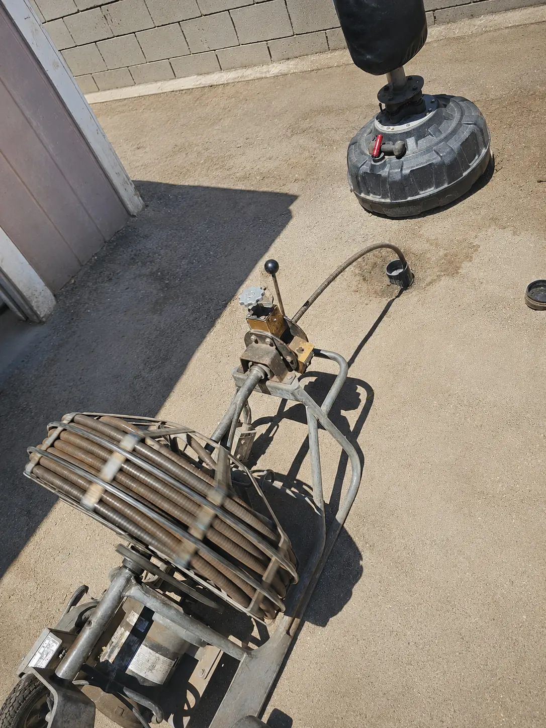 Professional drain cleaning machine in use outdoors